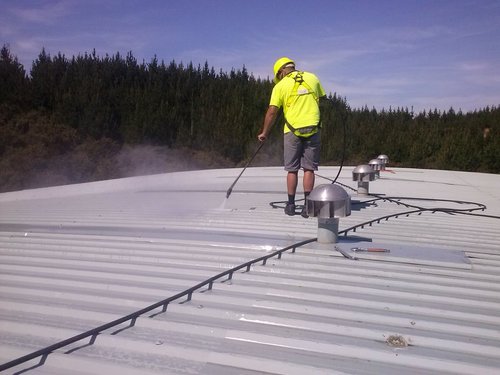 man_cleaning_roof